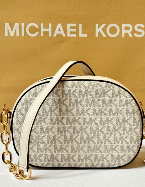 Load image into Gallery viewer, MICHAEL KORS JET SET GLAM SMALL FRONT POCKET OVAL CROSSBODY BAG MK LIGHT CREAM
